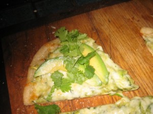 A slice of Avocado & Zucchini, with Cheese & Cilantro--ready to enjoy with a glass of chilled sauvignon blanc